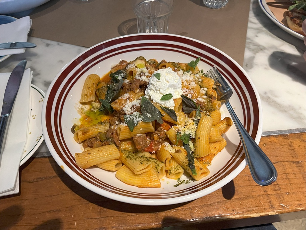 A plate of bolognese rigatonni.